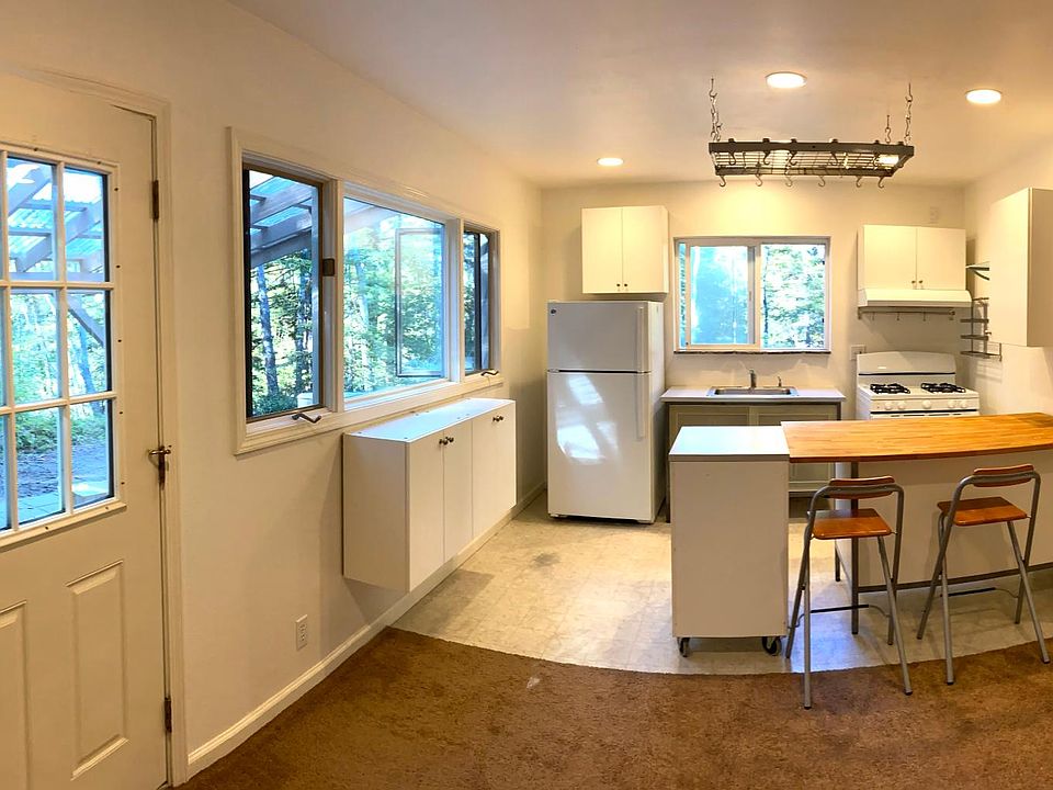Open living area with kitchen Island and stools