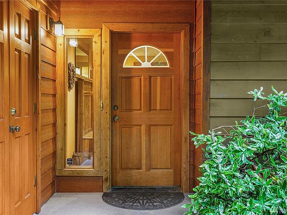 Flagstone path leads to a welcoming front entry.