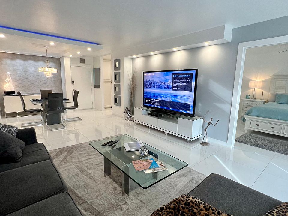 Spacious Modern Living Room, view looking into guest bedroom with double pocket doors.