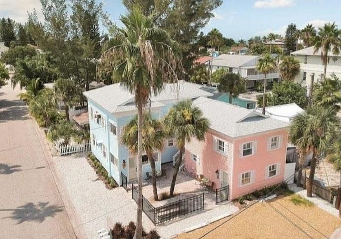 Unit is top floor of pink bulding