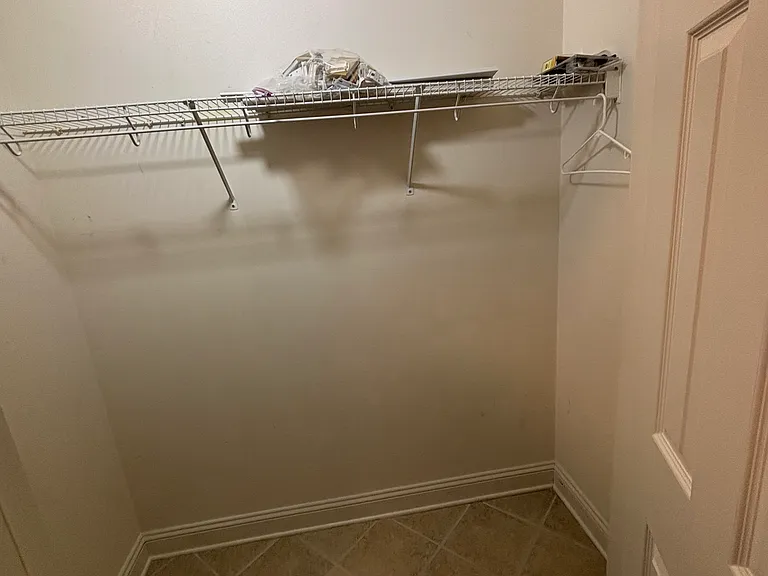 First floor hall closet across from door to garage