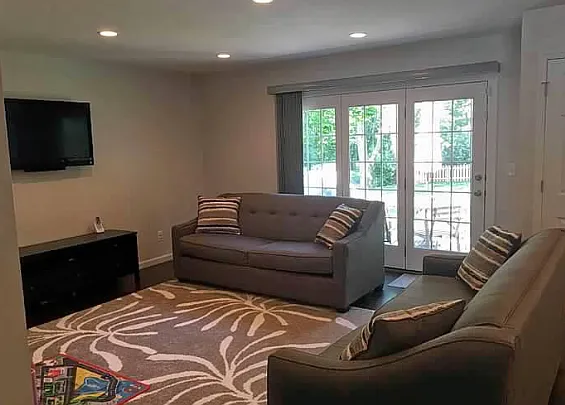 Living room, with door out to the large fenced backyard