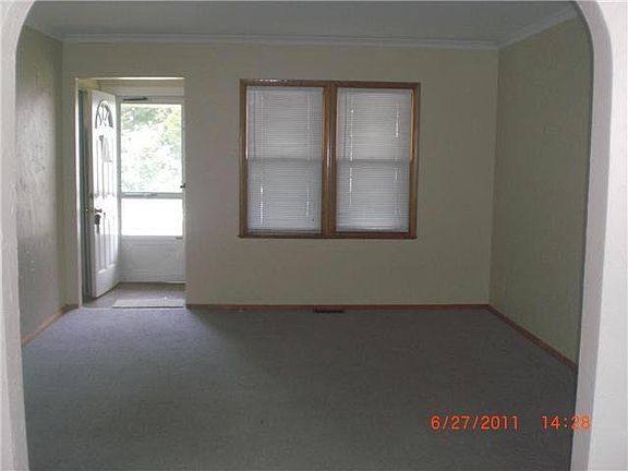 standing in dining room looking at front door