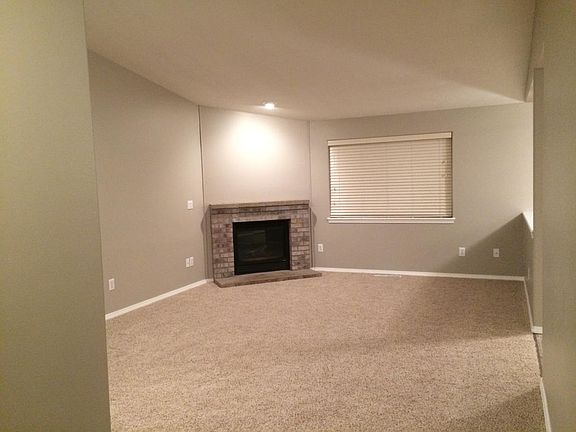 Living room: brick surround mantel with gas fireplace. Bran