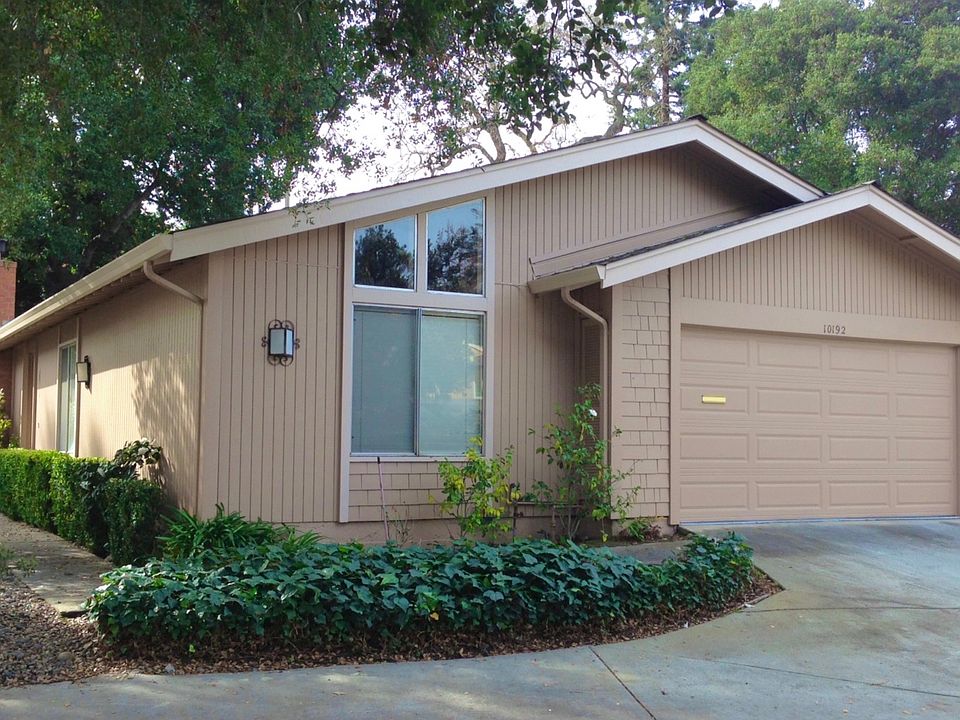 Single-level home with attached garage and yard