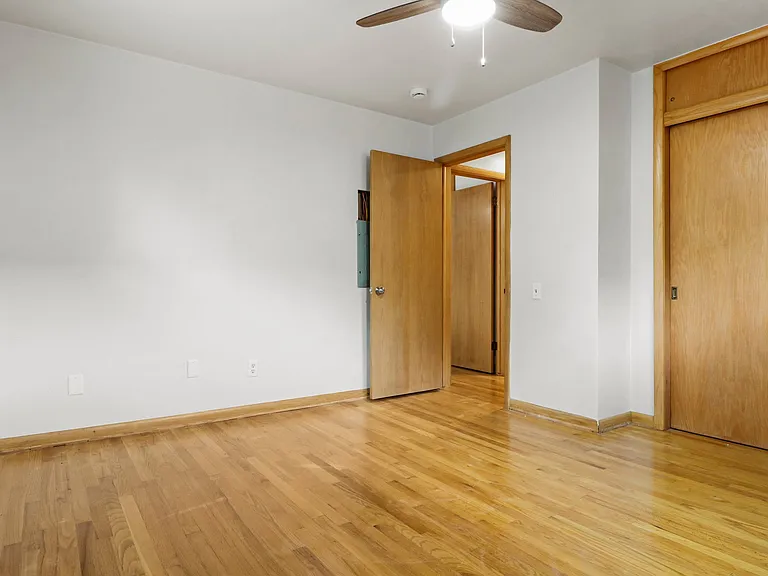 Spacious bedroom with plenty of storage. Nice ceiling fan, brand new and beautiful hardwoods.