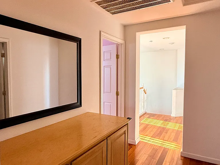 Shared hallway storage area between the upstairs bedrooms