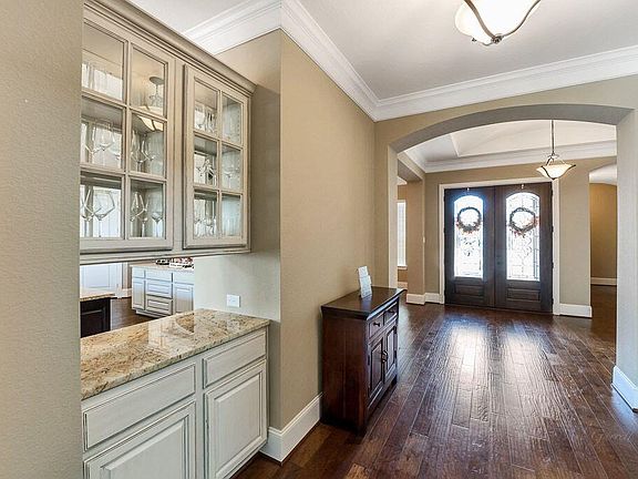 Your guests will be greeted by double front doors and gleaming wood floors!