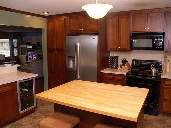 New custom cherry cabinets, breakfast bar, and island