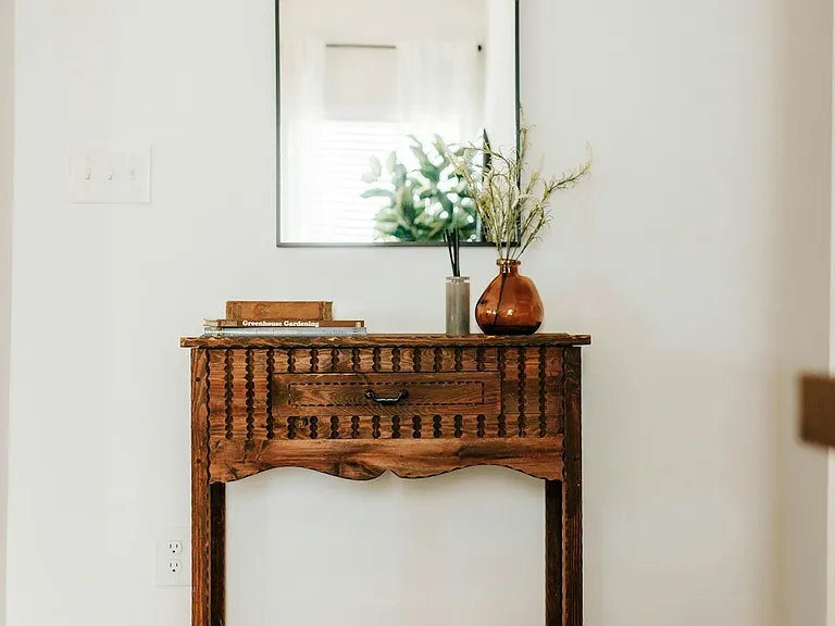 Add a touch of rustic charm to your stay. This console table makes the space feel warm and inviting.