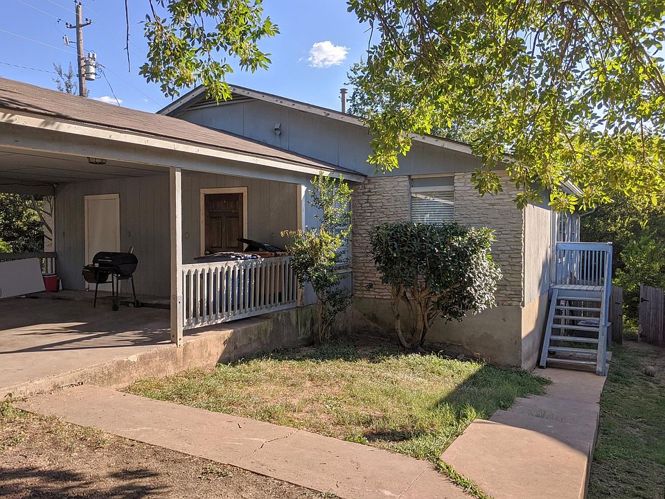 Front yard, covered carport, door on carport opens to storage closet.