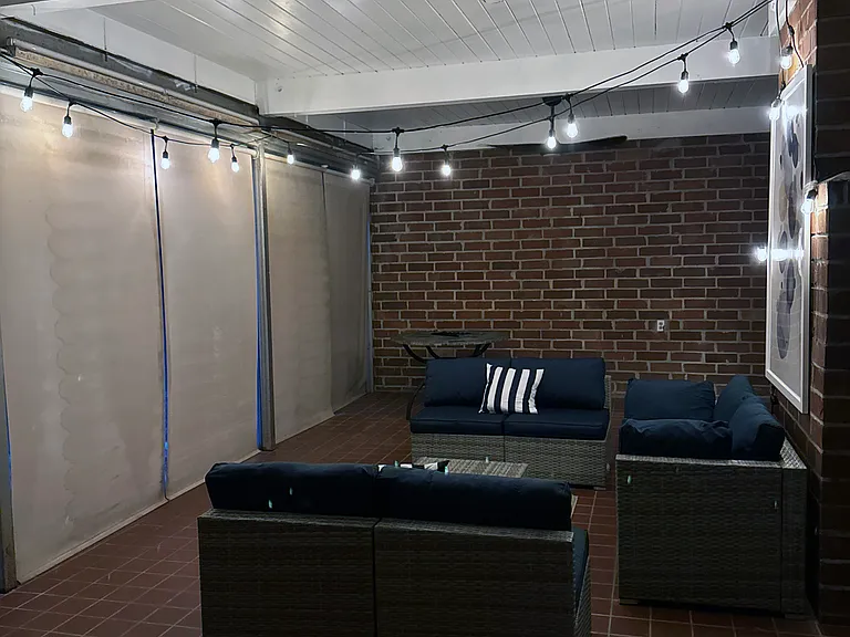 Florida room showing window treatments and fans (furniture not included)