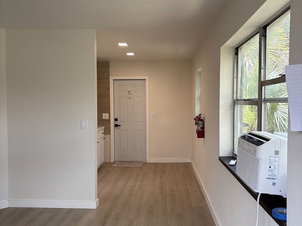 View from the entry: to living and kitchen on the back