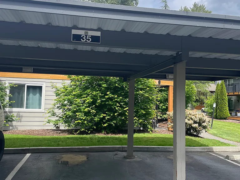 reserved covered parking spot in front of condo unit