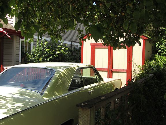 Car port with a tool shed