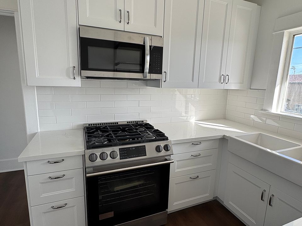 Completely remodeled kitchen with new appliances and quartz countertops