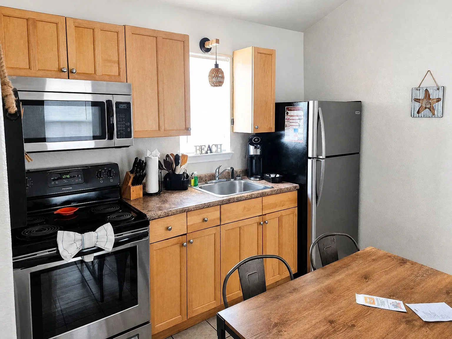 Kitchen with stove, microwave and refrigerator