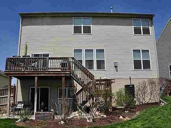 Back of house with deck