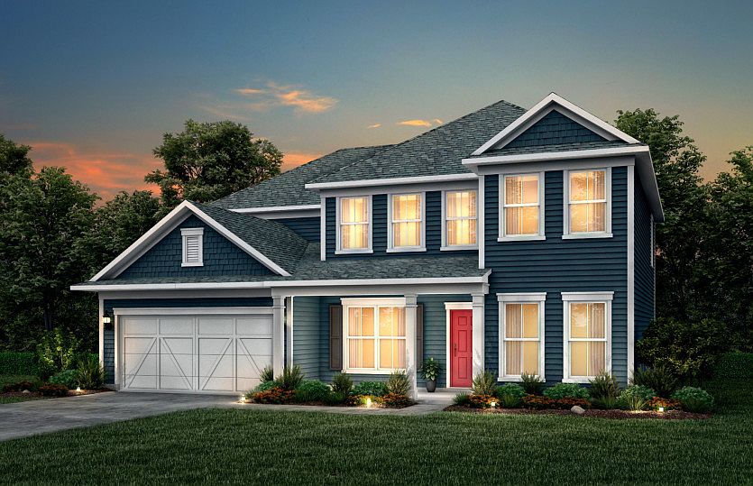 Wingate Exterior 52 features Hardie Board siding, shakes, covered front porch and 2 car garage