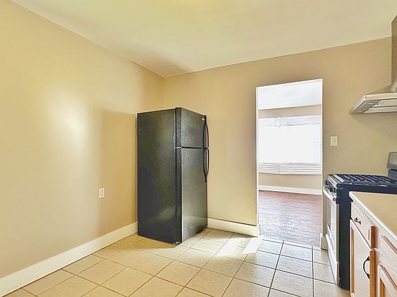 Kitchen, refrigerator, gas stove.