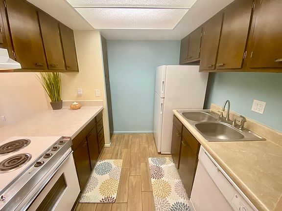 Charming kitchen with with lots of storage, including full pantry. New dishwasher, kitchen faucet and range hood. Pristine retro range is in great working order.