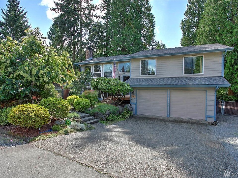 Welcome Home to this lovely 5 bedroom 3 bath home located on a quiet cul-de-sac in the well-established neighborhood of Maplewood Heights. The serene quarter acre setting offers meandering pathways with fruit trees, berry bushes, gorgeous flowering rhododendrons, azaleas and mature landscaping providing spring & summer color. Raised garden boxes & the backyard irrigation system will have you anticipating a bountiful vegetable garden. Ideal for entertaining, enjoy the multi-level outdoor gathering spaces which include a covered upper deck for year-round grilling, an expansive lower deck, sprawling lawn, patio & hot tub. Inside, the large living room has a cozy fireplace, sunny picture windows & open light lines to the dining room. The charming eat-in kitchen has beautiful refinished hickory cabinets, views to the gorgeous back yard, a pass-thru to the dining room and a large pantry. 