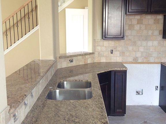 Breakfast bar and kitchen over look the open living room!