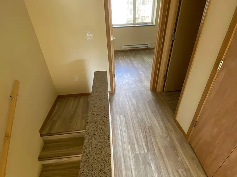 Hallway looking towards rear bedroom, bathroom is on the right