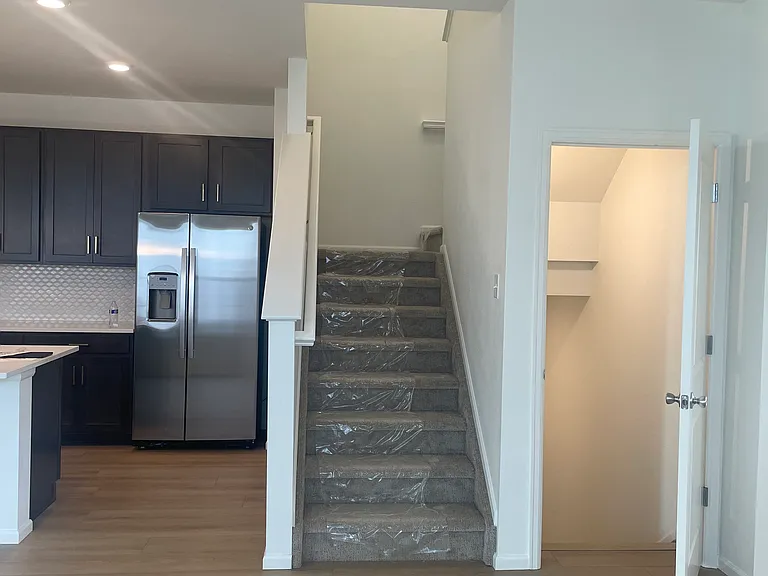 Stairs to upper level and basement (unfinished)