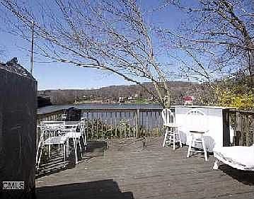 Decks lead directly to dock on river.