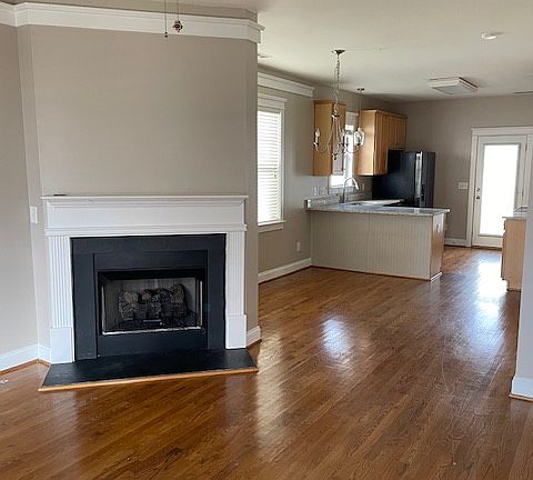 View from front door into living room, dining area and kitchen