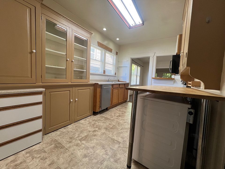 Entrance off of the alley leads into the kitchen.