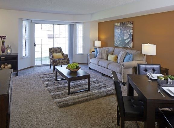 Comfortable Living and Dining Room with Walk Out Patio!