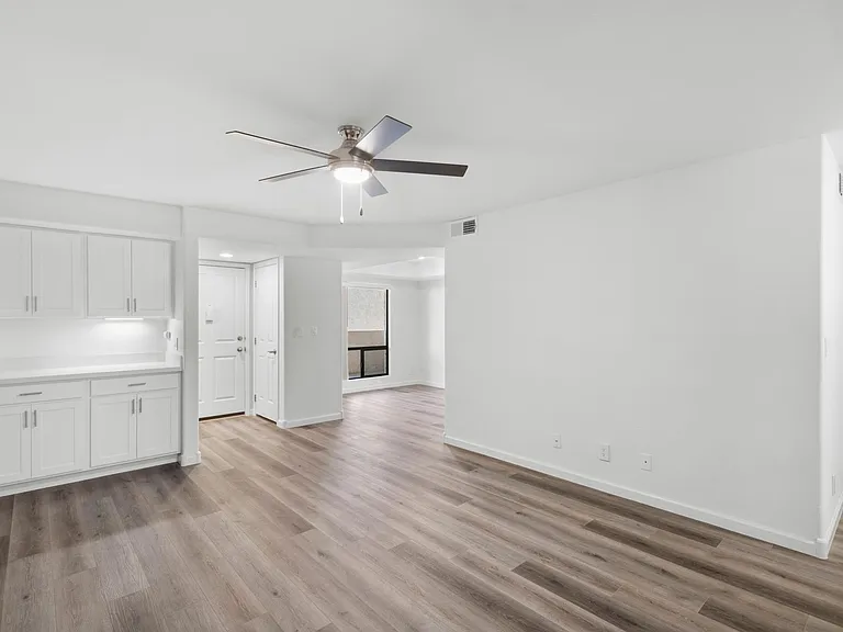 Remodeled 1 bedroom living room. Ceiling fans are included in living room and bedrooms in all our apartments.