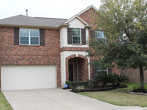 Handsome curb appeal with professional landscaping and brick/stone exterior. Two car garage and driveway,