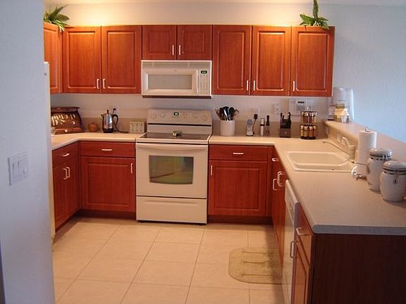 Kitchen with upgraded cabinets, appliances, sink and countertops