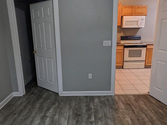Living area features brand new flooring, and an oversized closet perfect for bikes or other storage needs.