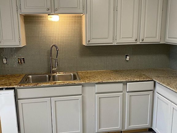Updated kitchen with fresh paint, new faucet and dishwasher.