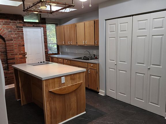 Other Side of Kitchen with 2nd Sink and Utility Closet with Washer / Dryer in Unit
