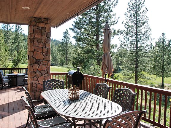 Six-person covered outdoor dining, overlooking the golf course