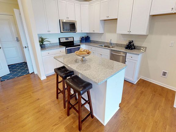 Spacious kitchen with island and ample storage space