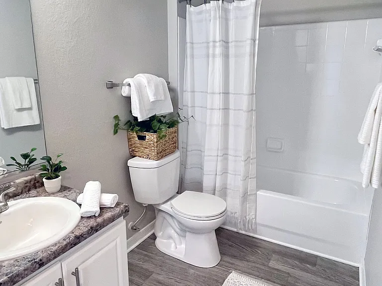 Experience bathroom luxury with expansive vanities and large mirrors, creating a luminous space for relaxation.