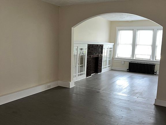 Dining leads to Living Room and the whole apartment has new floors!