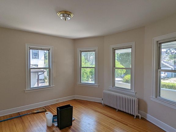 Bright bay windows light up the 1st floor living room