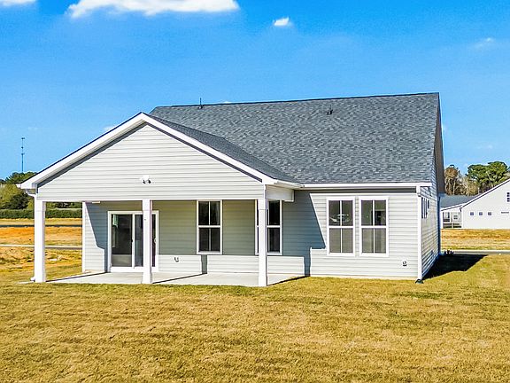 The Easton s rear exterior offers generous outdoor living with a wide, open backyard