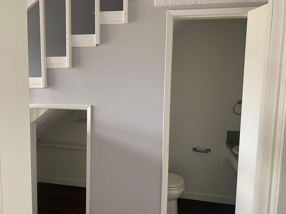 1/2 bath downstairs/small storage (Not actual unit- Similar Layout)