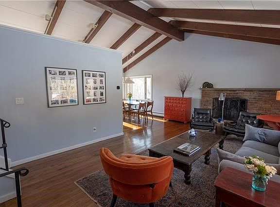 The bright and cozy living room invites you in and compels you to linger.