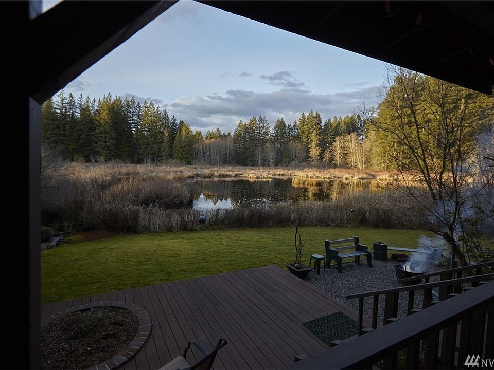 Your own 11.5 acre conservation easement paradise with all of the best that the PNW has to offer. There are 66 nesting species o