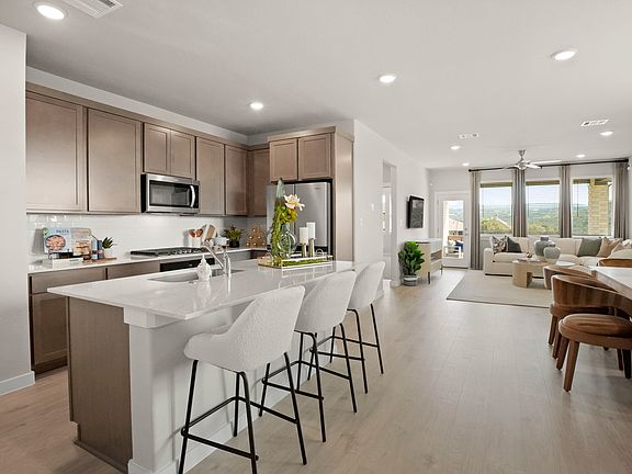 Kitchen in the Willow home plan by Trophy Signature Homes - REPRESENTATIVE PHOTO