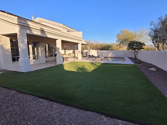 Large, bordered backyard provides room to place recreational equipment or do outdoor entertaining. Privacy wall.